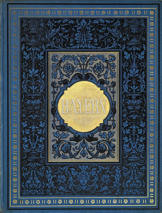 Ein blau-goldenes Buch mit der Aufschrift "Bayern" auf dem Cover, das mit detaillierten Verzierungen geschmückt ist.