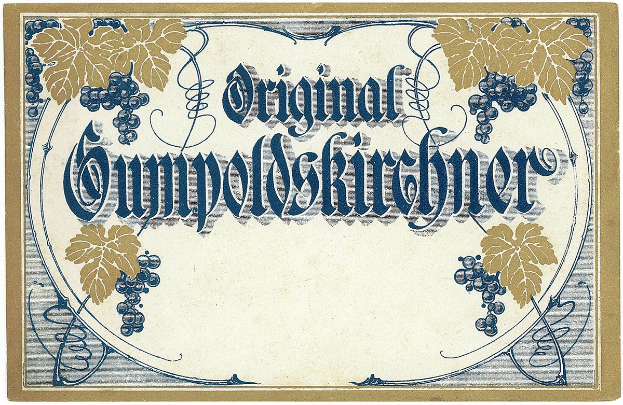 Ein altes deutsches Wein-Etikett mit einer Illustration von Trauben und Blättern und einem Text, der den Wein-Typ angibt.